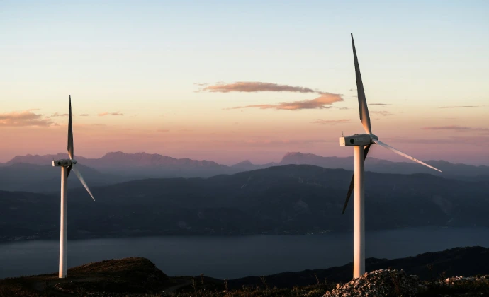 two white wind turbines