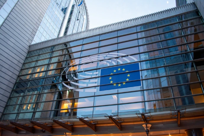 European Union flag reflected on modern building glass
