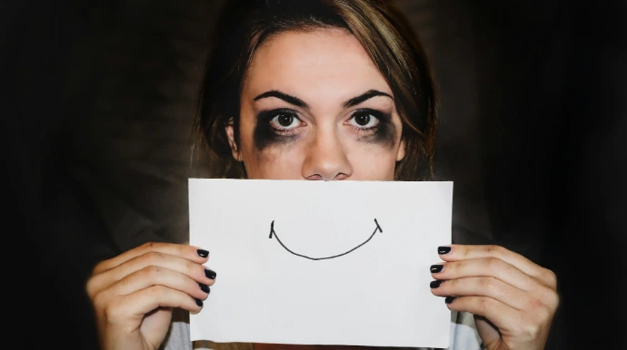 person holding white printer paper