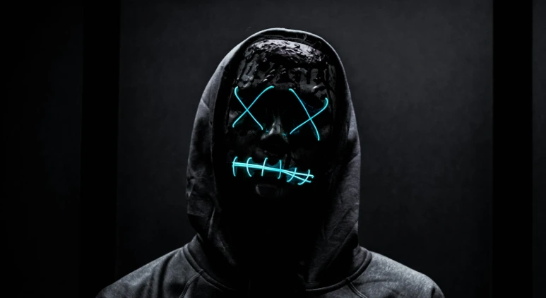 man in black hoodie with red and white heart print