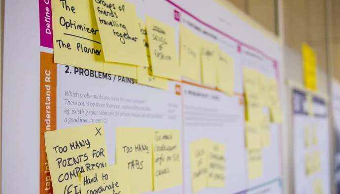 printed sticky notes glued on board